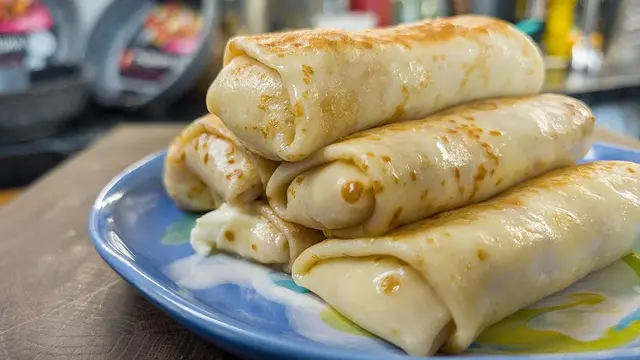 Тонкие блины на молоке с сырной начинкой