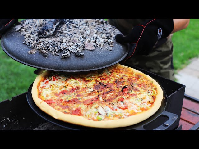 Вкусная пицца на огне